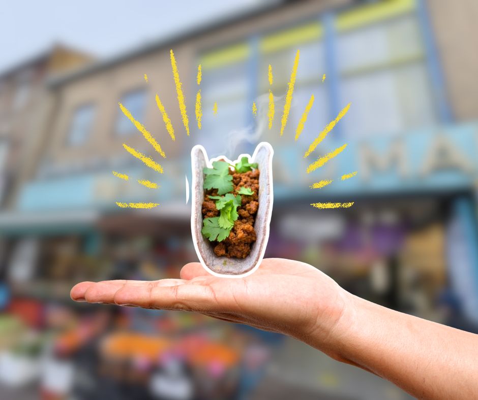 A Floating taco outside Nag’s Head Market representing the best tacos London at Proper Tacos